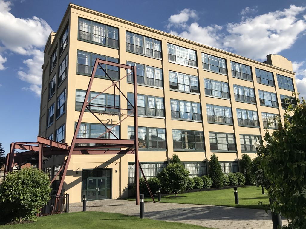 a view of a building with a yard