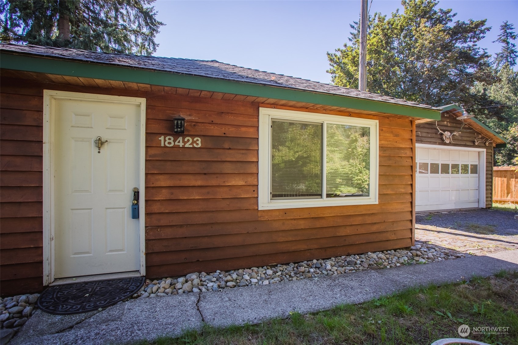 a view of a house with a small yard