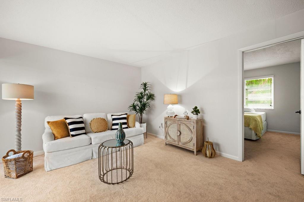 a bedroom with furniture and a lamp