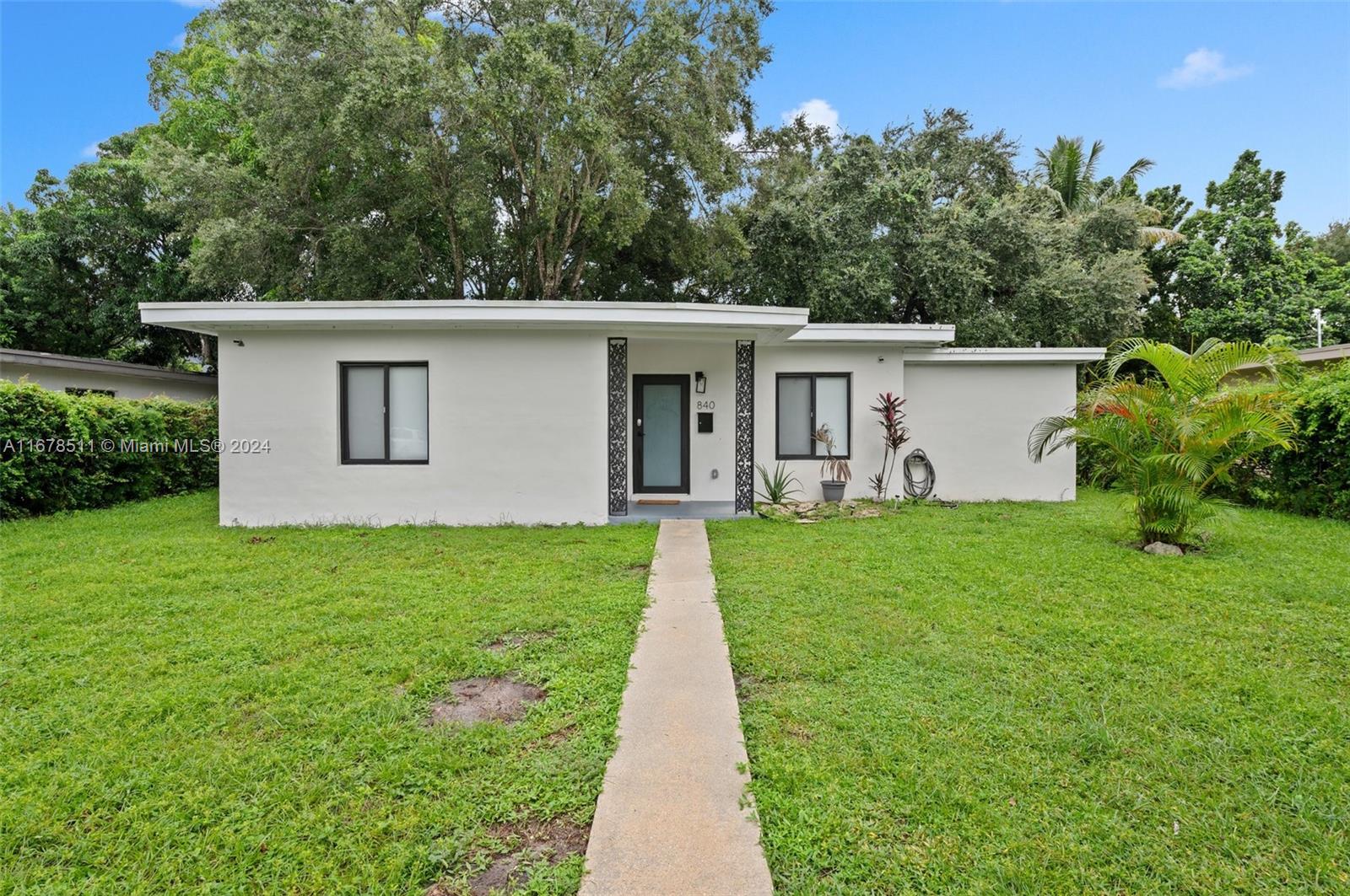 front view of a house with a yard