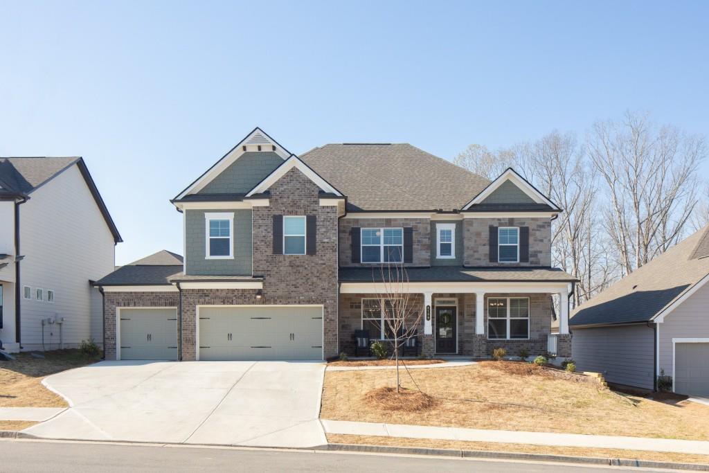 a front view of a house with a yard