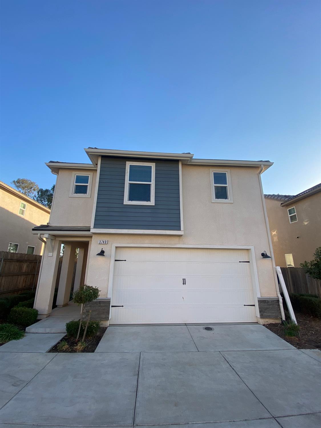 a front view of a house with garage