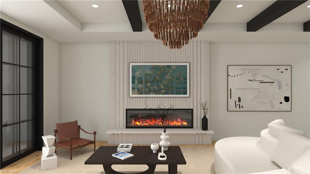 a living room with furniture a fireplace and wall paintings