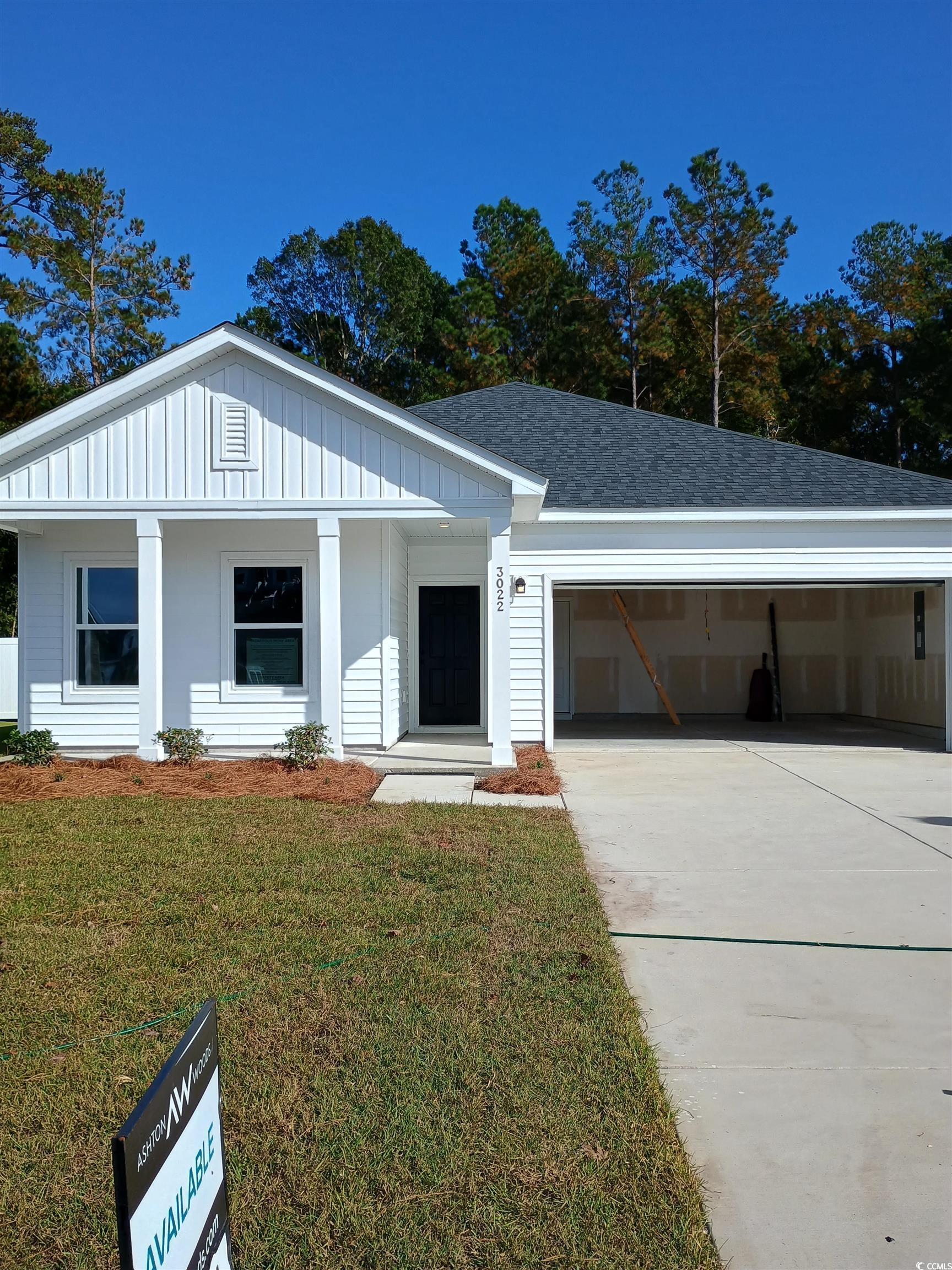 View of front of home featuring a front lawn and a