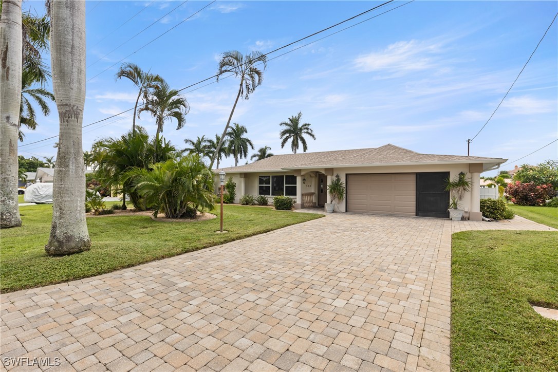 front view of a house with a garden