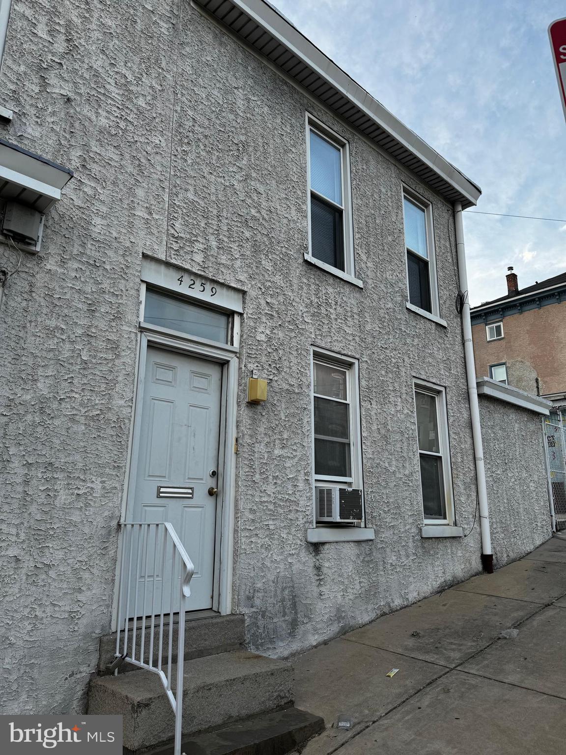 a front view of a house with parking space