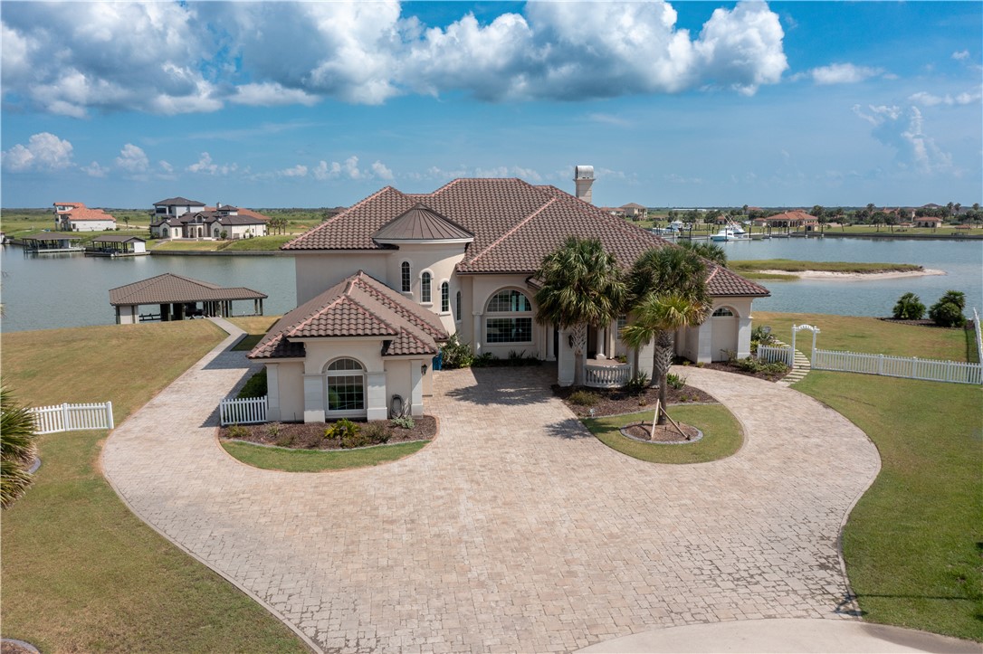 a view of a house with outdoor space and a lake view