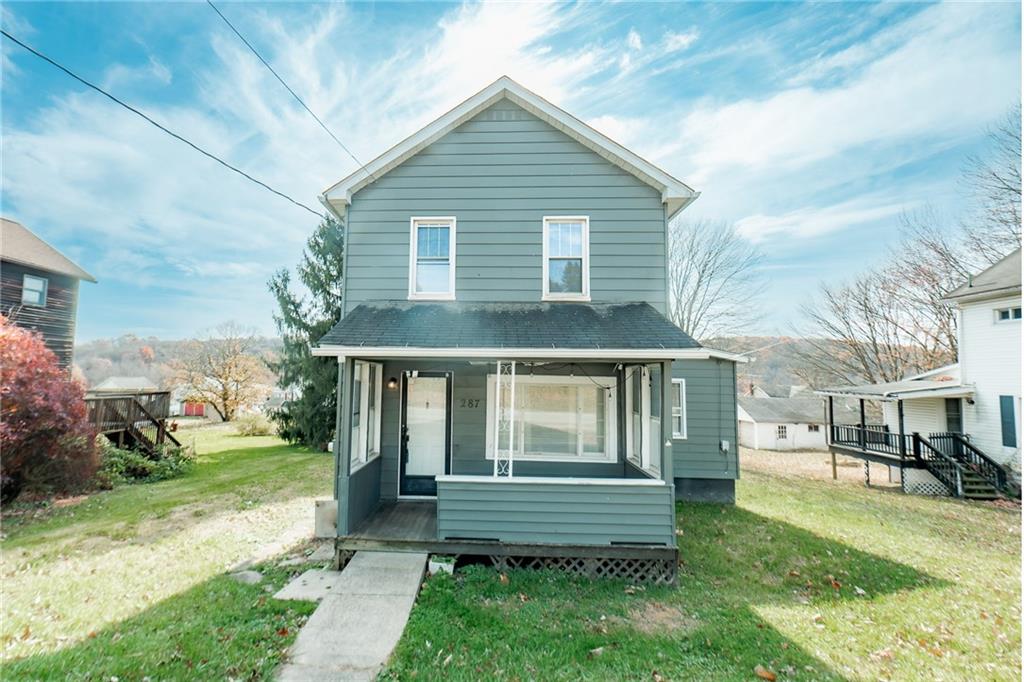 a front view of a house with a yard