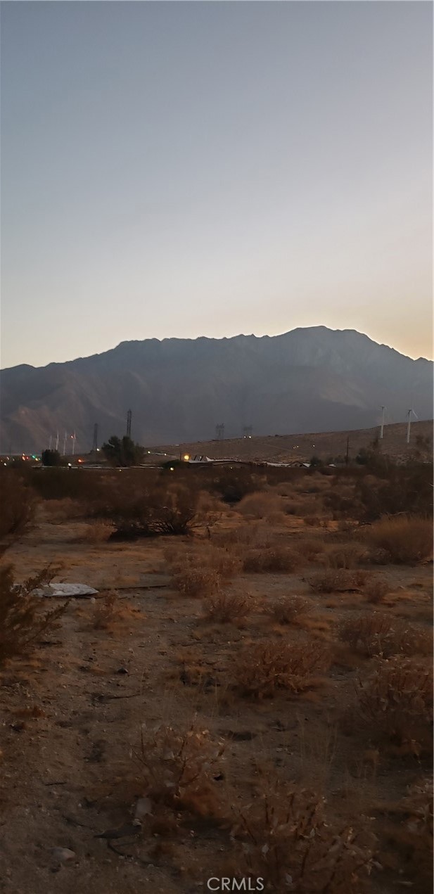 a view of a town with mountains in the background