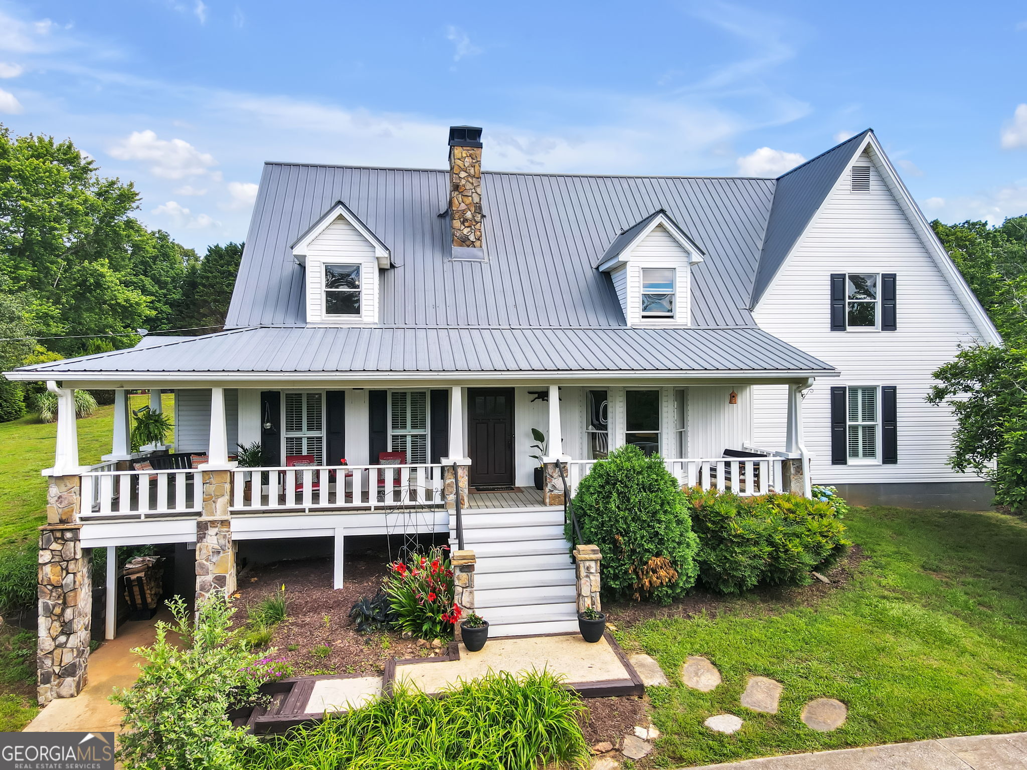 front view of a house with a yard