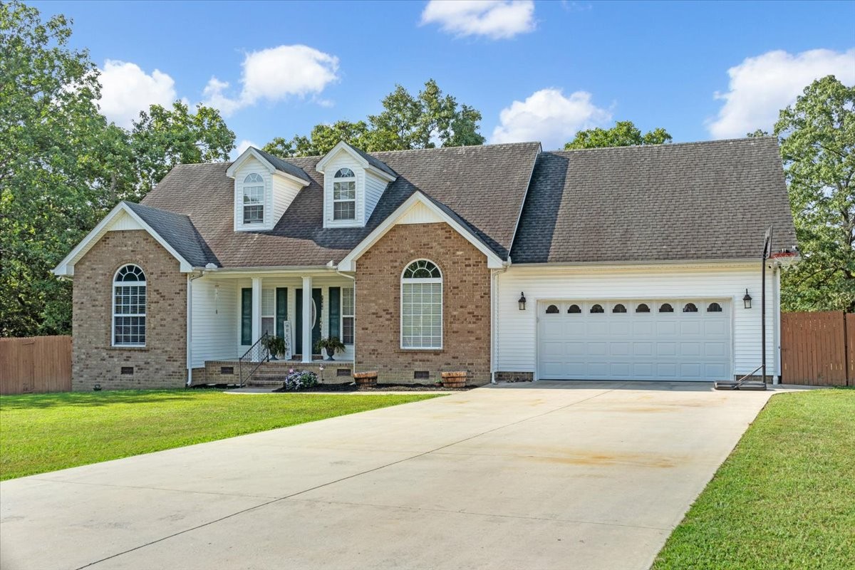 a view of house with yard and entertaining space