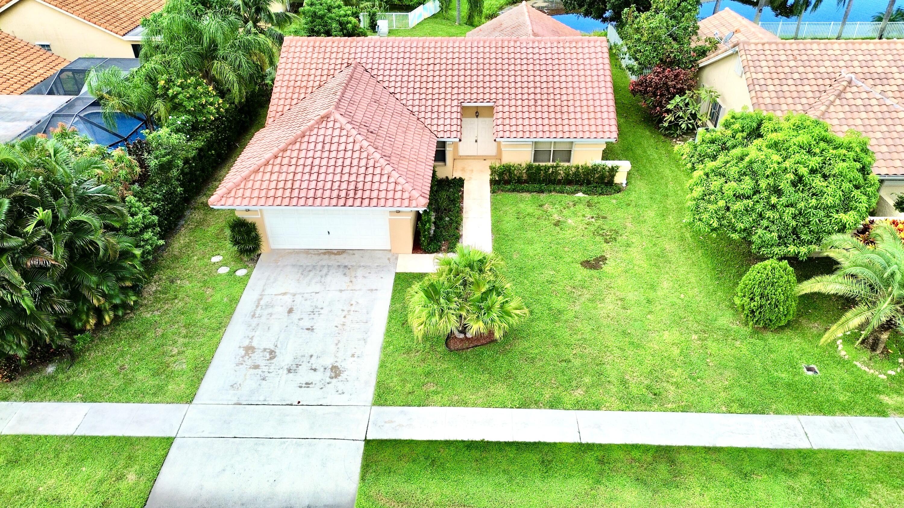 a aerial view of a house with a yard