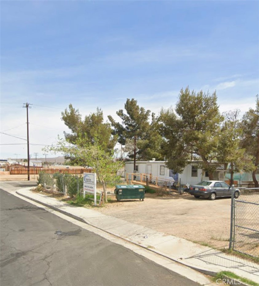 a street view with large trees