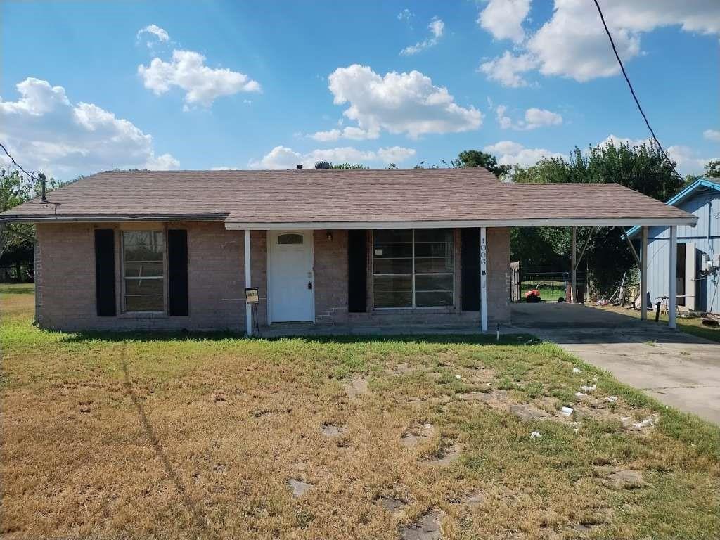 a house with yard in front of it