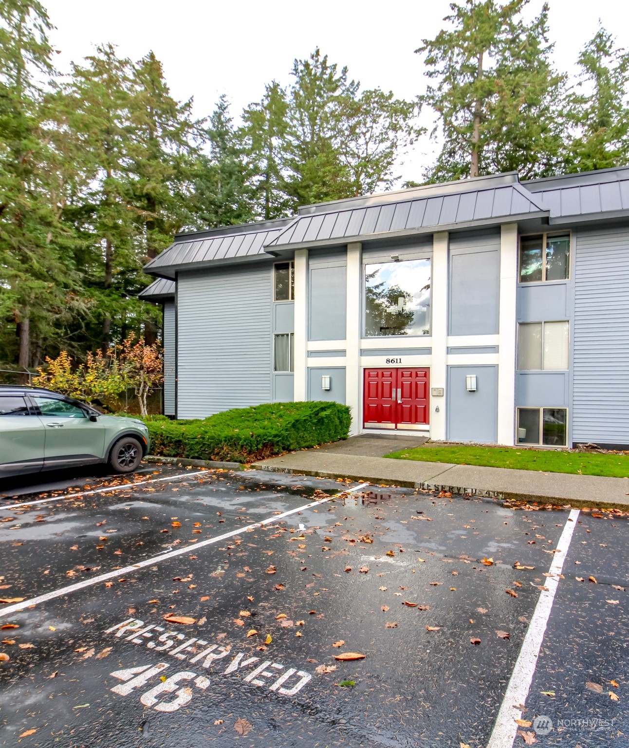 a view of a car park in front of a house