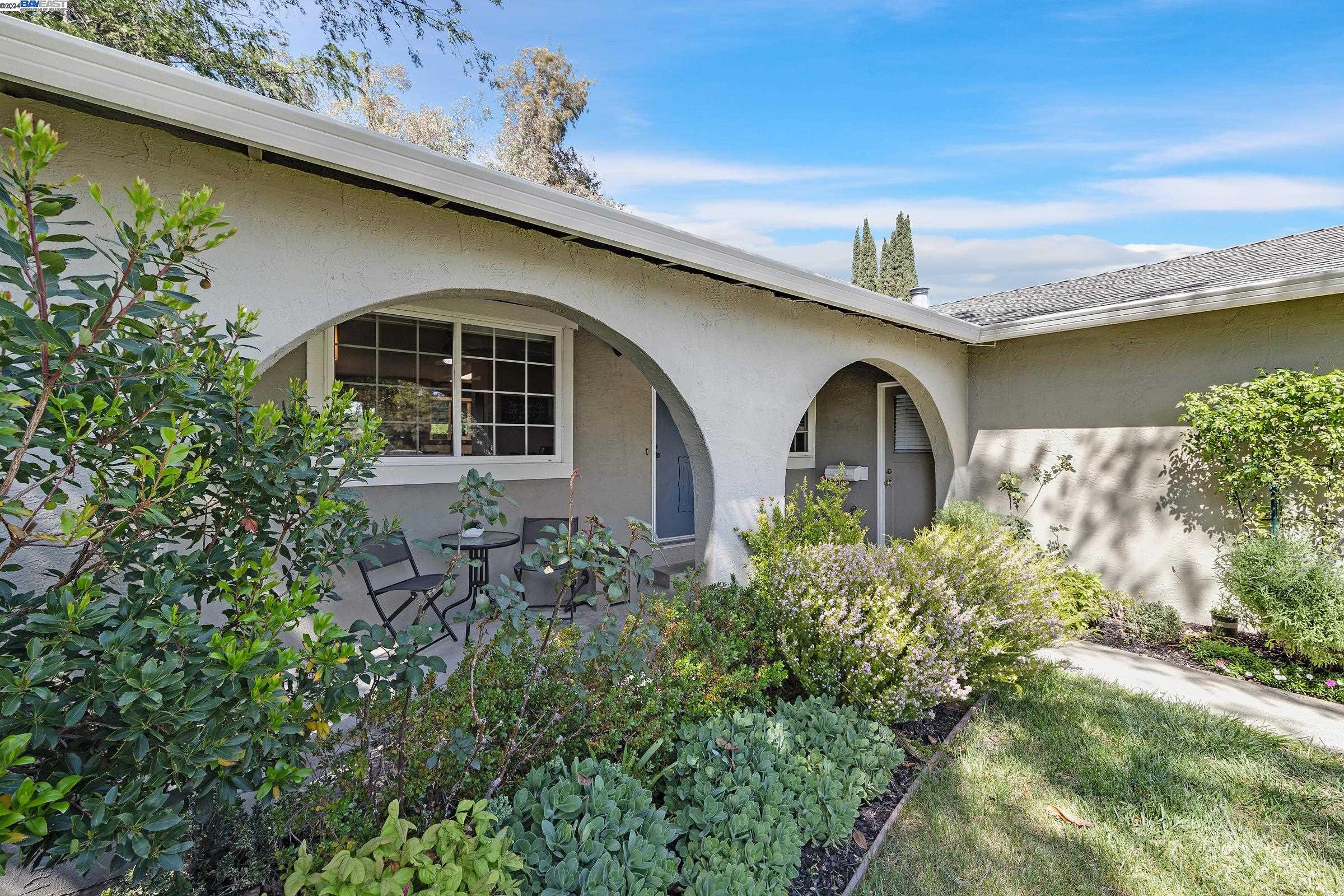 a front view of a house with garden