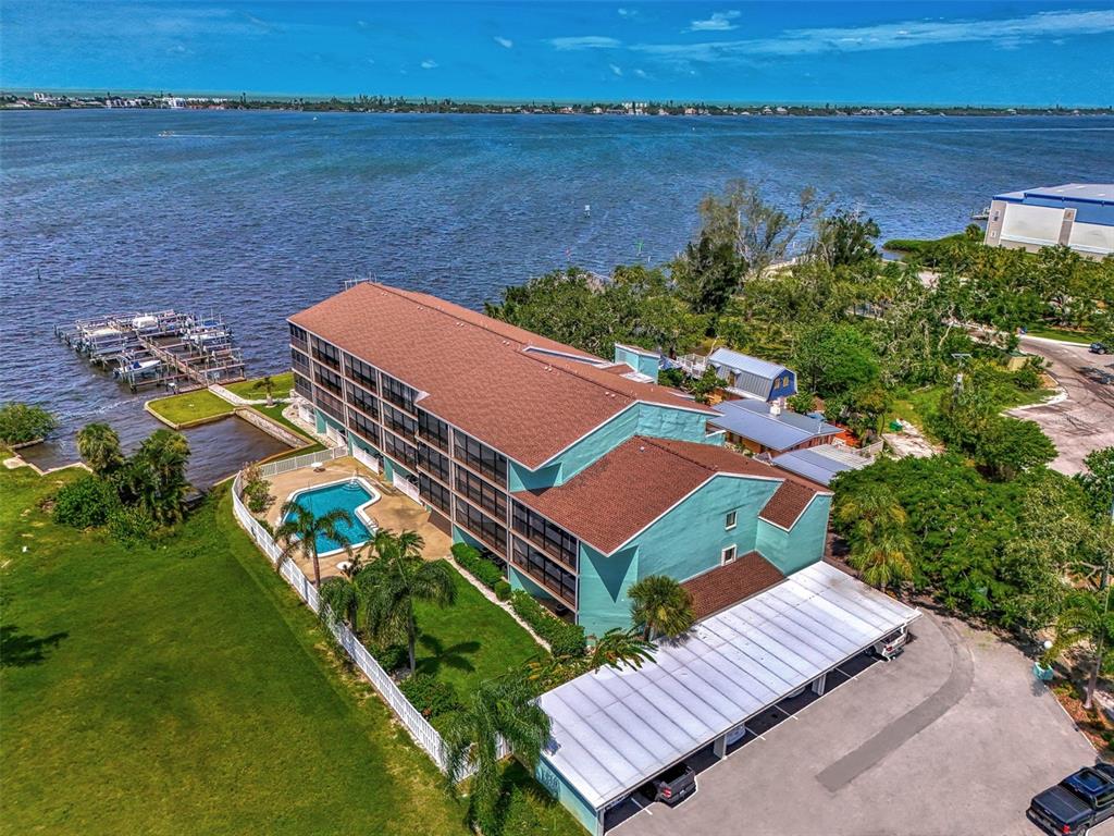 an aerial view of a house with a lake view