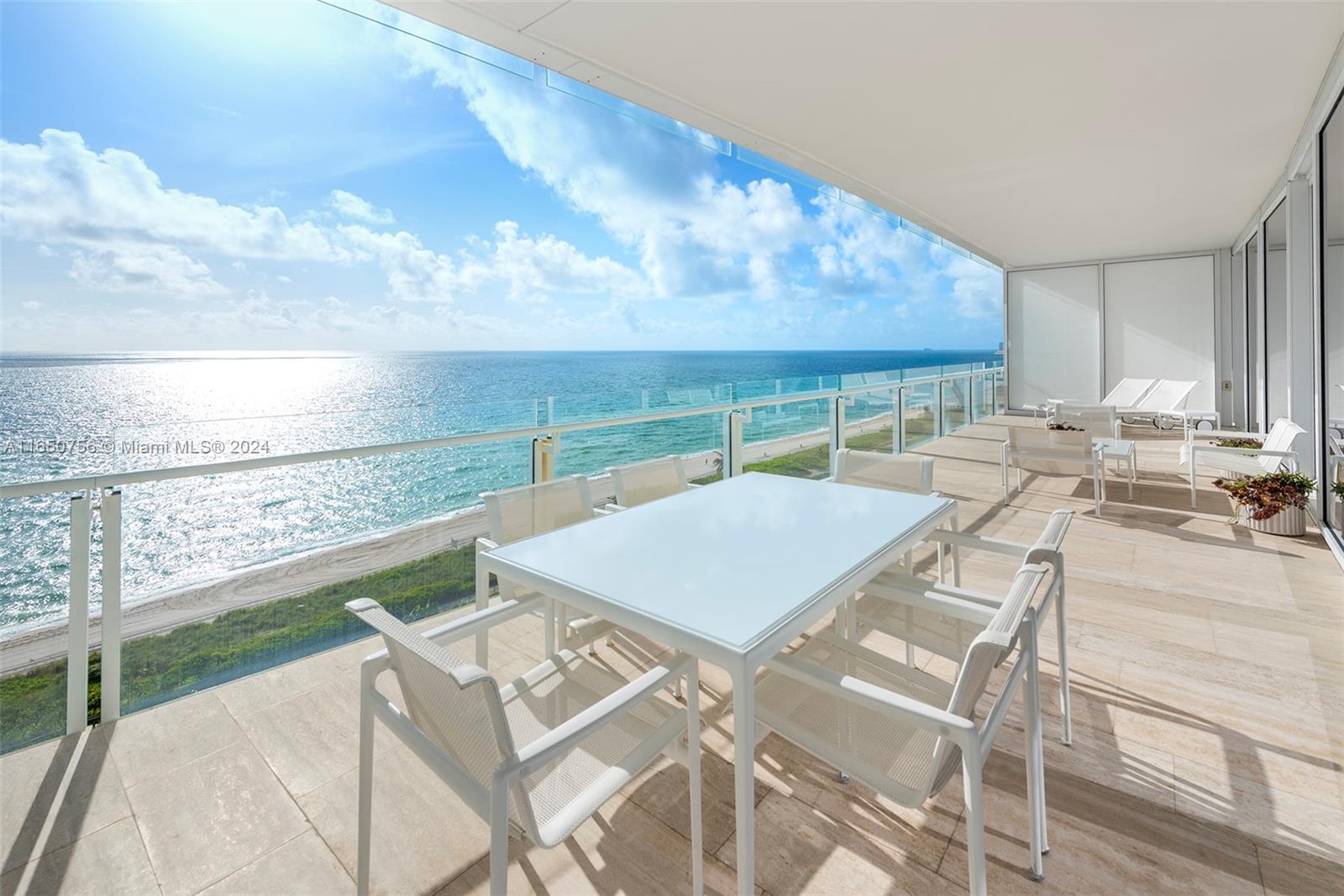 a view of a patio with a table and chairs