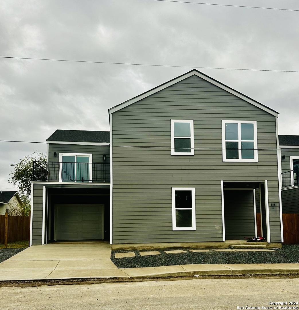 a front view of a house with garage