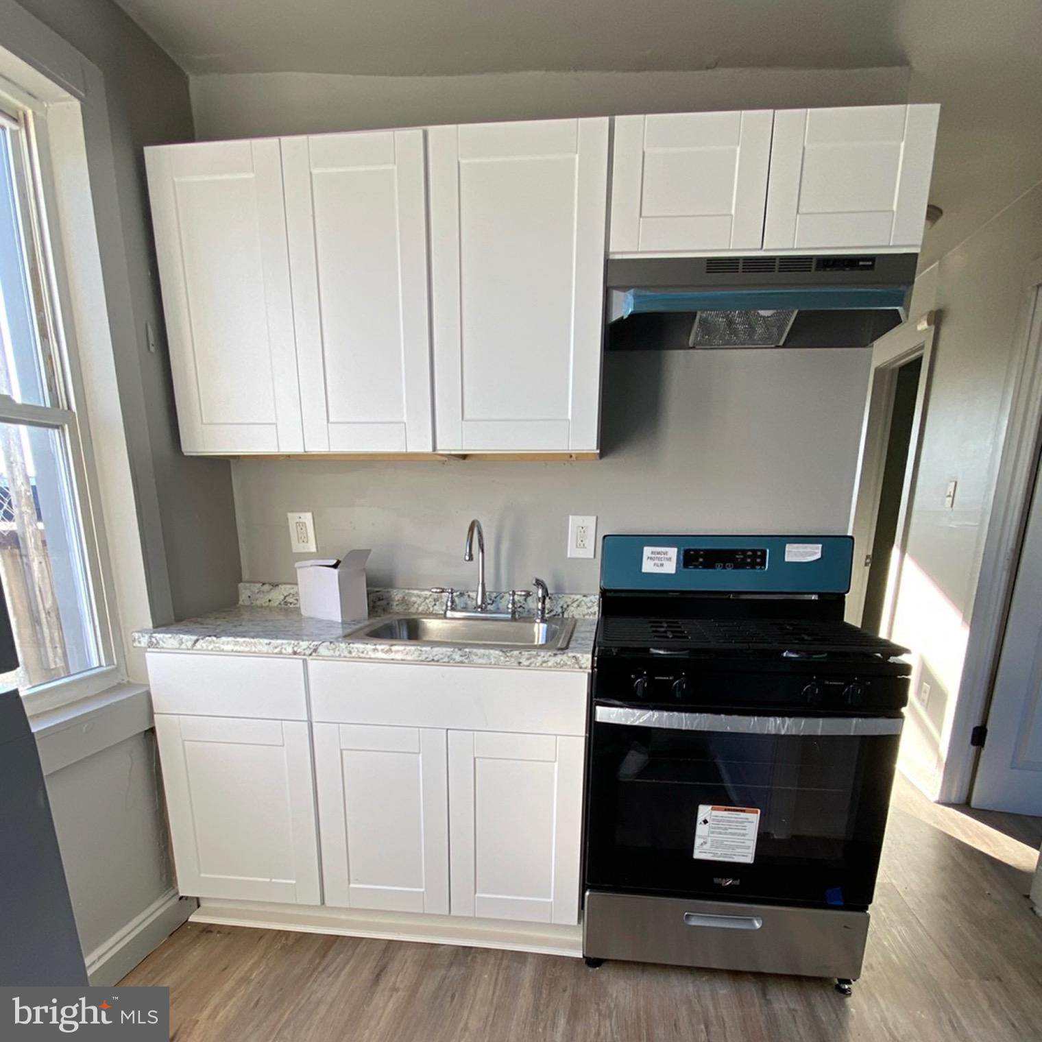 a kitchen with a sink and cabinets