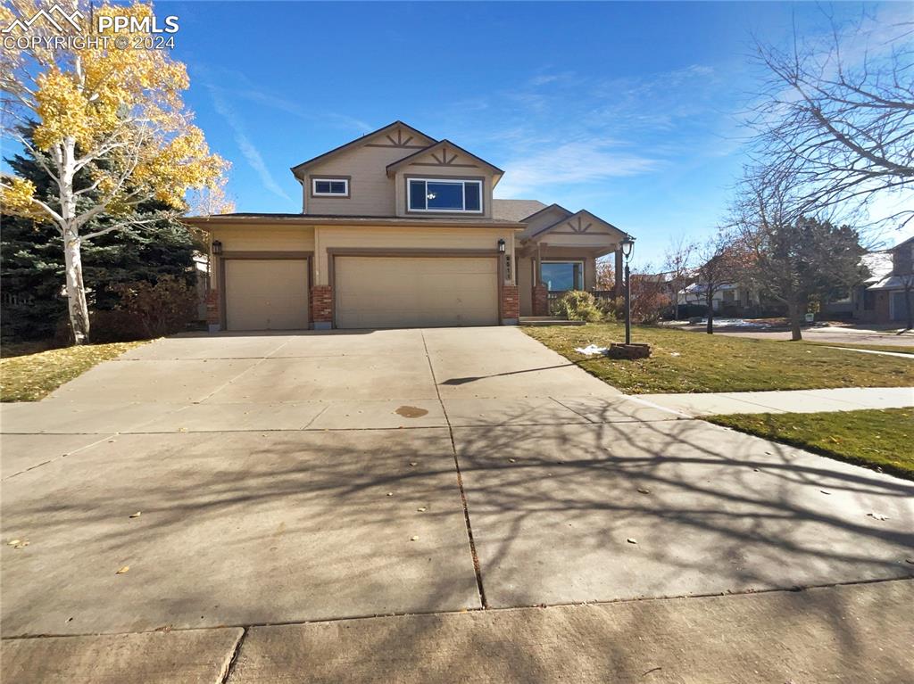 a front view of a house with a yard