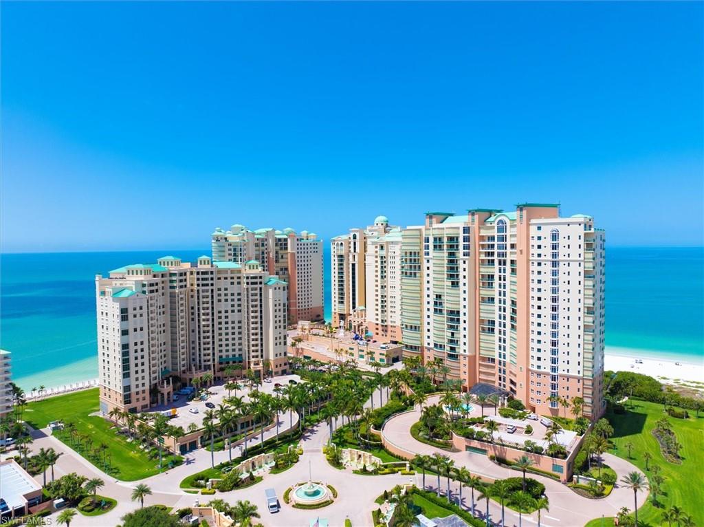 Aerial view with a water view and a view of the beach