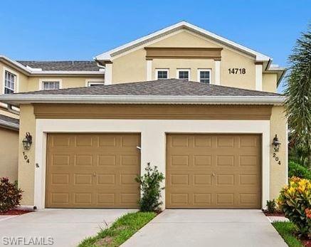 a front view of a house with a garage