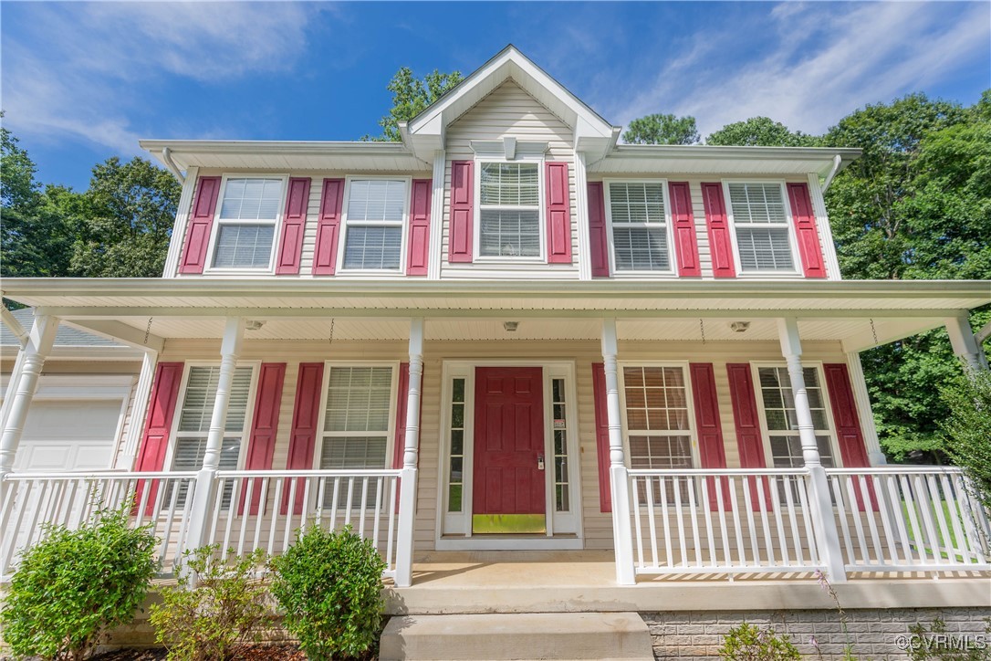 View of front of house featuring covered porch