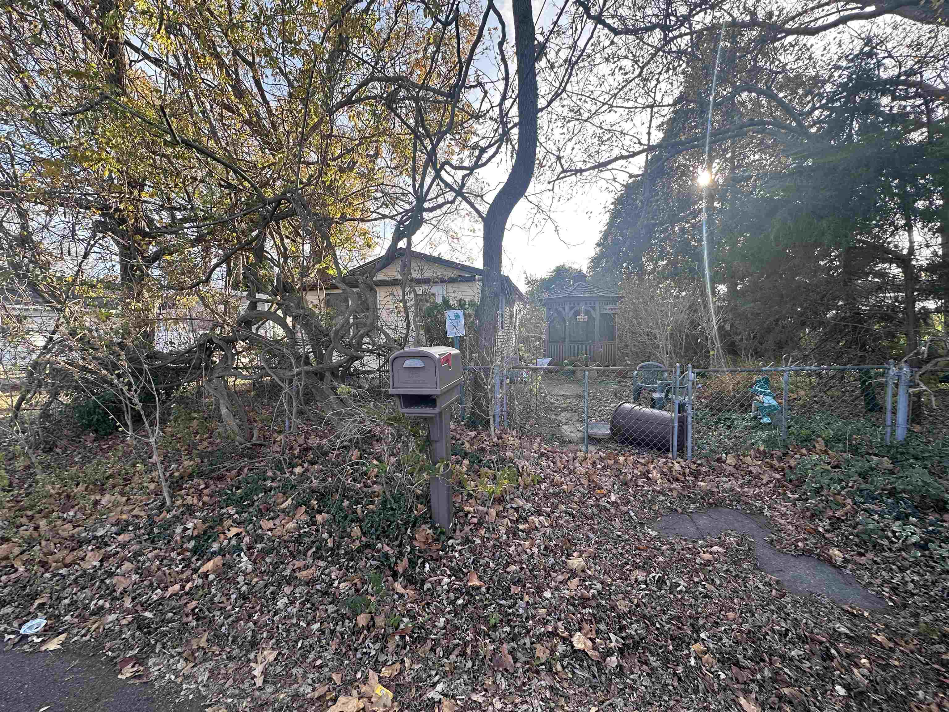 a view of a house with a backyard and sitting area