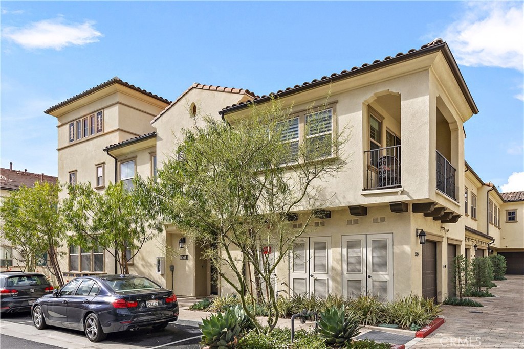 a front view of a residential apartment building with a yard