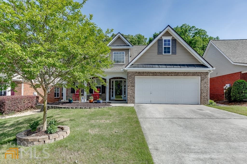 a front view of a house with a yard