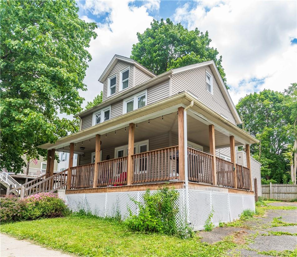 Front view of property with wraparound porch