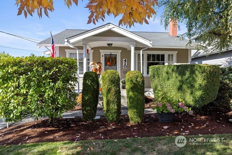 front view of a house with a garden