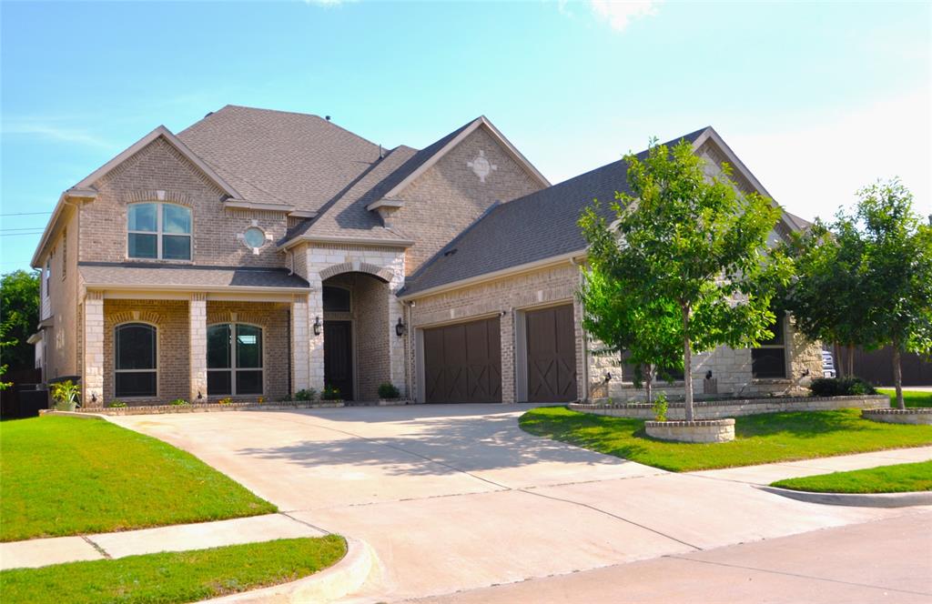 a view of a house with a yard and plants