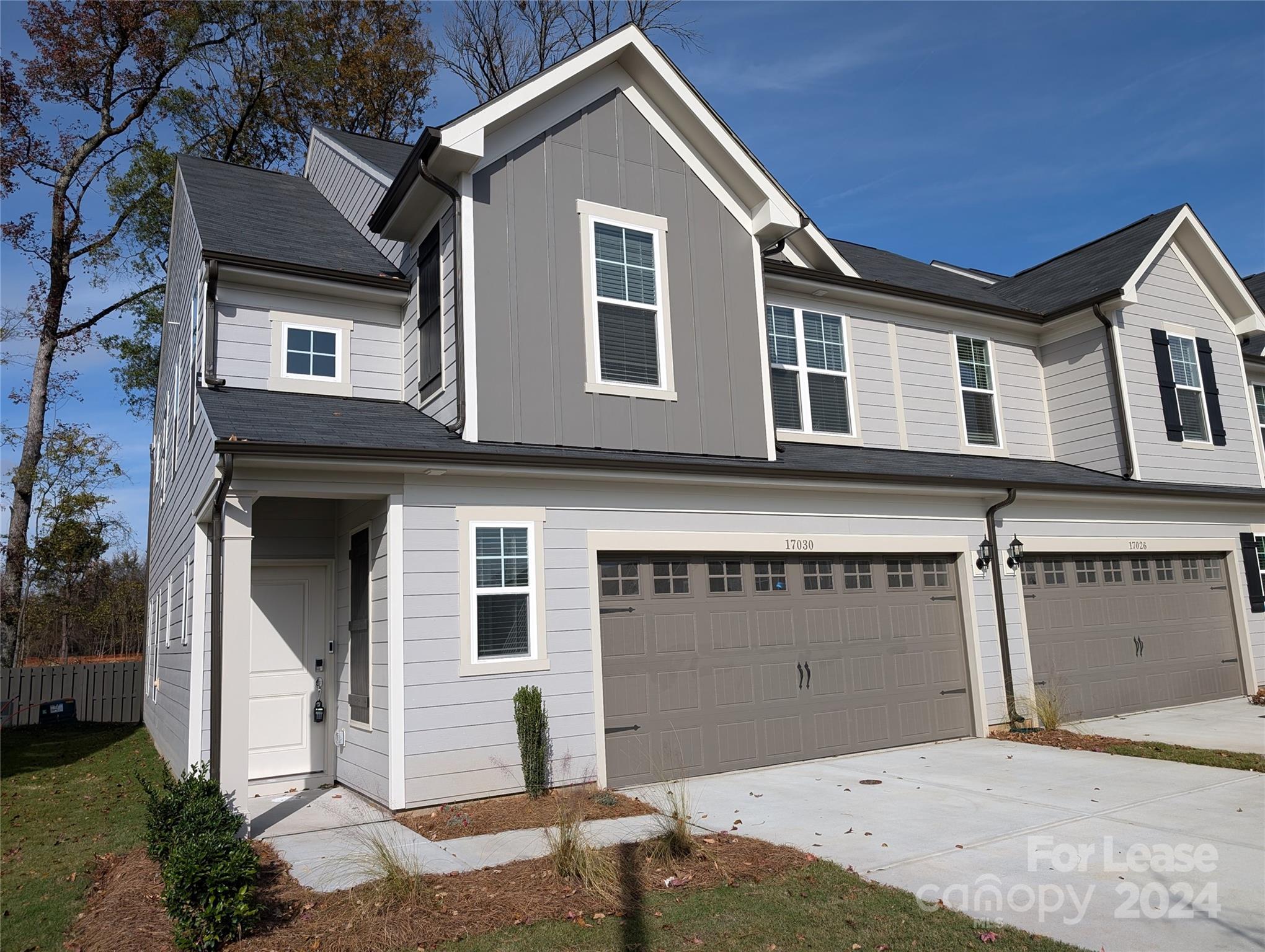 a front view of a house with a garage