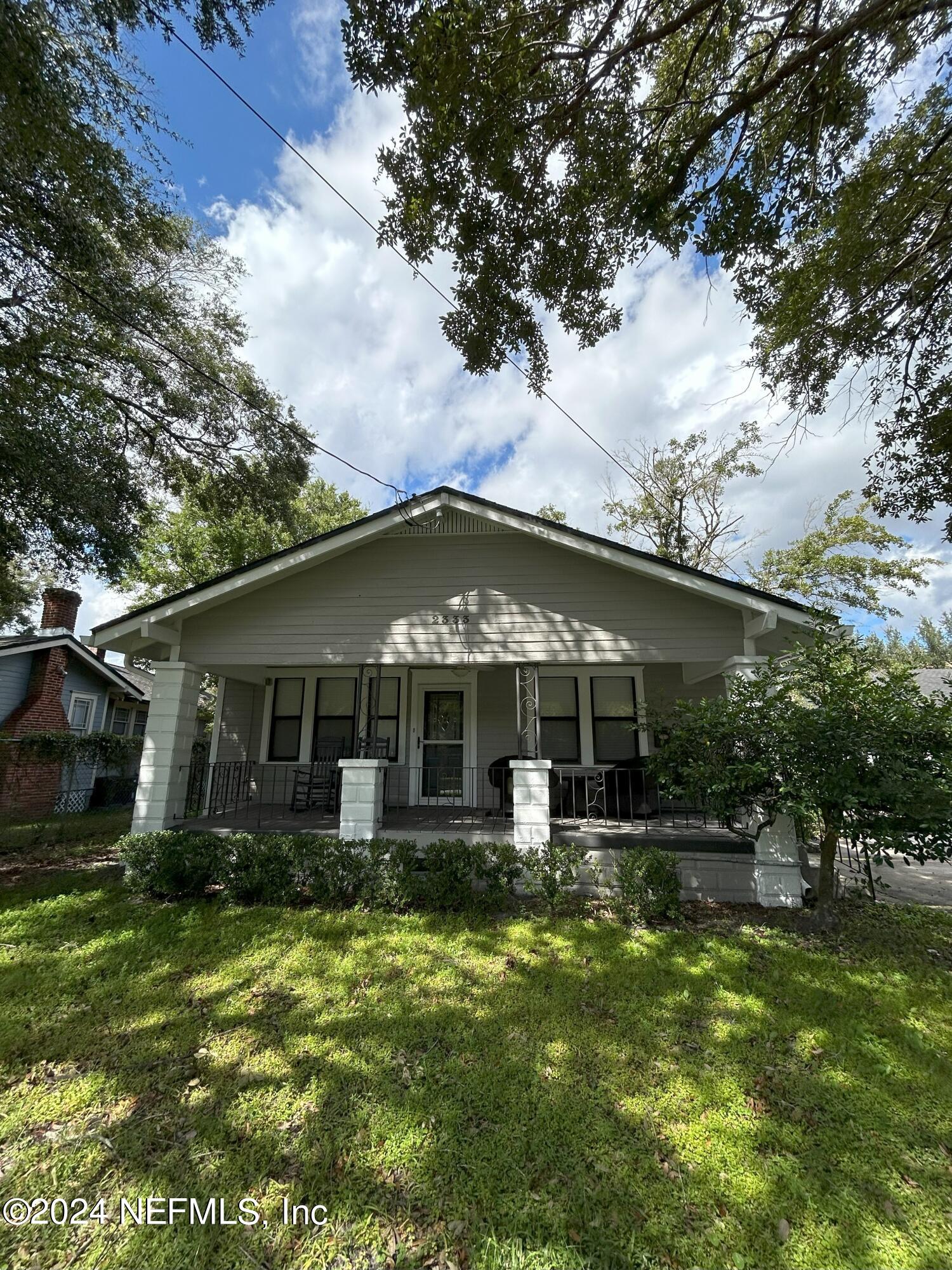 front view of a house with a yard