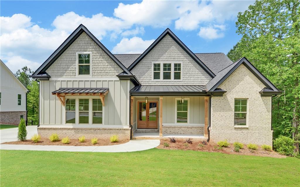 a front view of a house with a yard