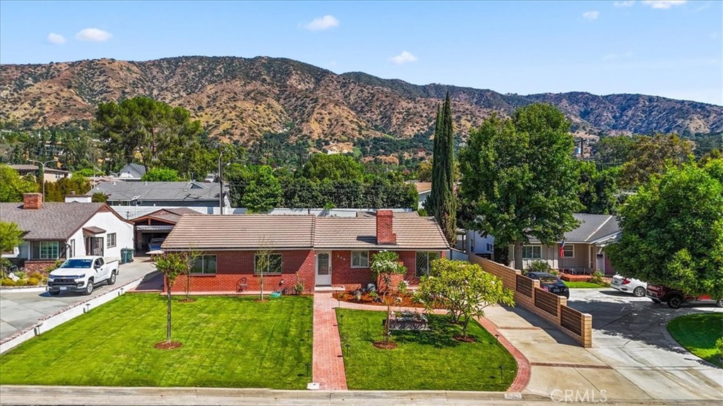 an aerial view of a house with a garden