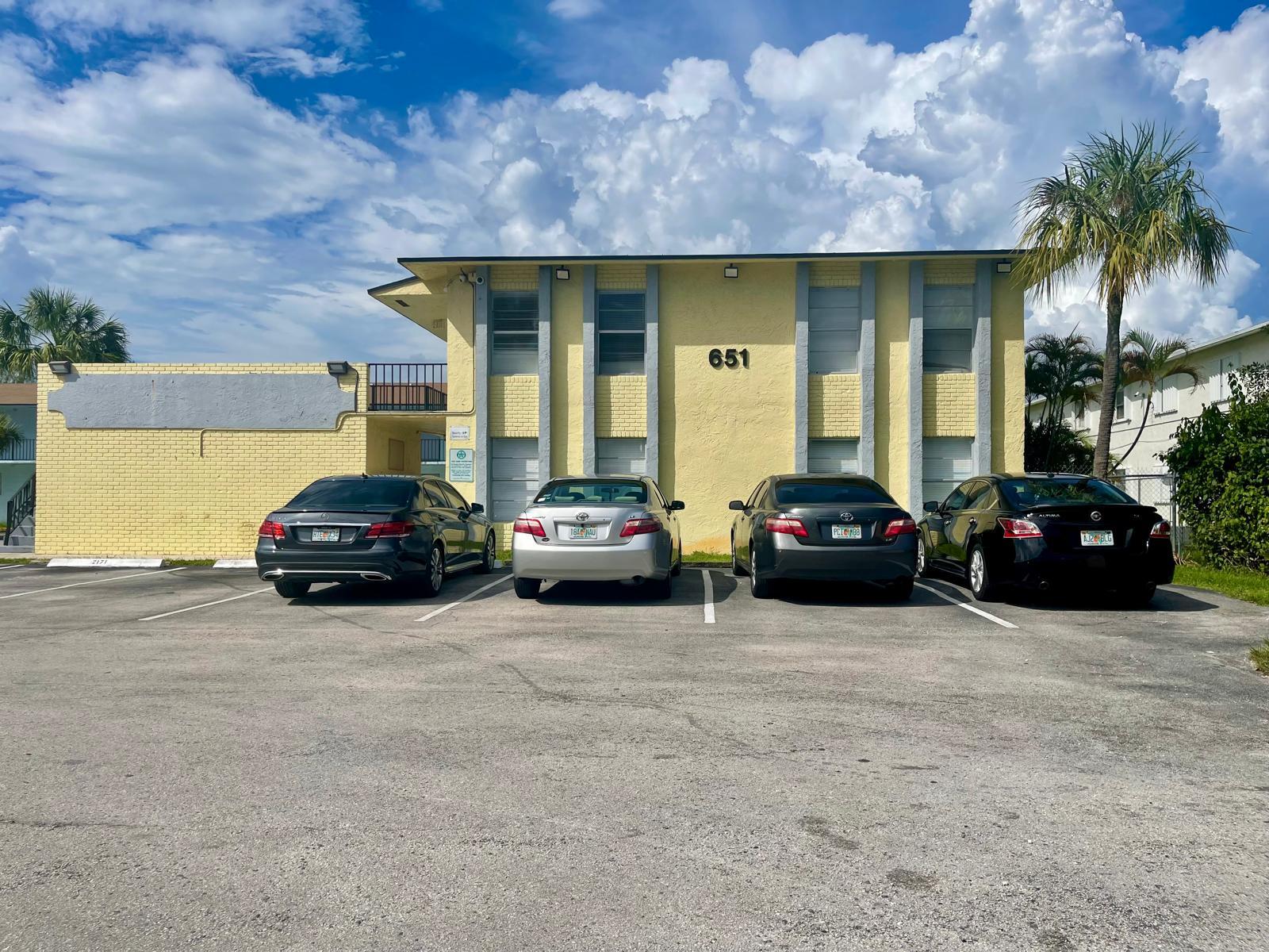 a view of a car parked in front of a building