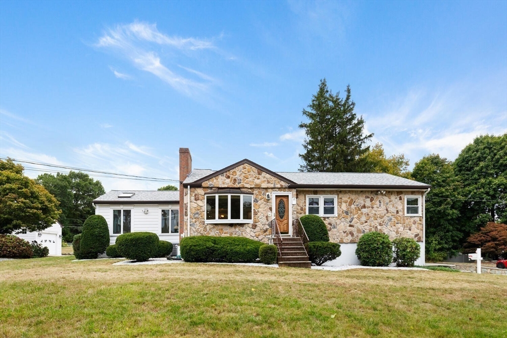 a front view of a house with a yard