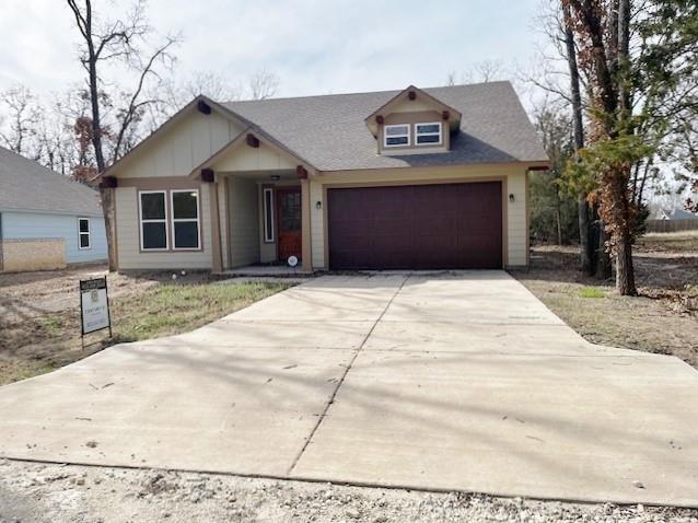 a view of house and garage