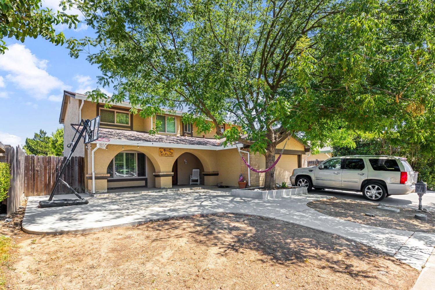 a view of a cars parked in front of a house