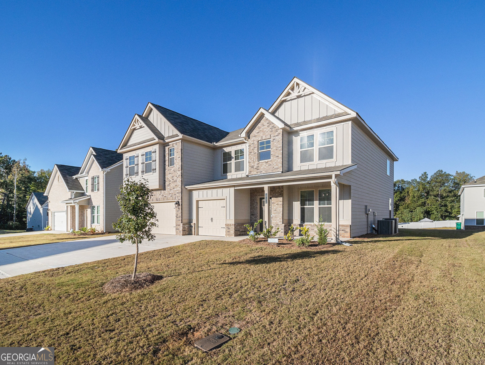 a front view of a house with a yard