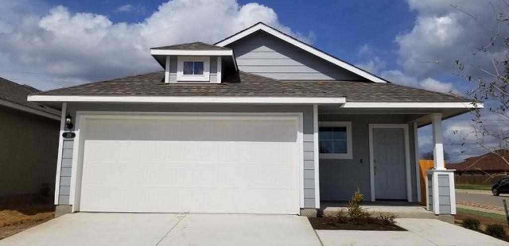 a front view of a house with fence