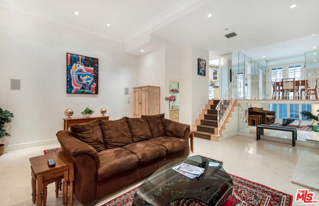 a living room with furniture and a couch