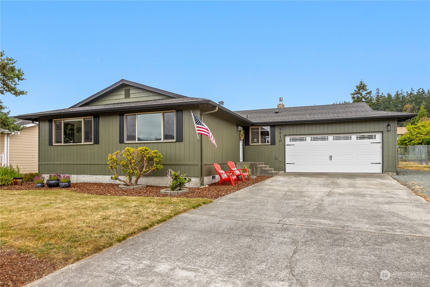 a front view of a house with yard