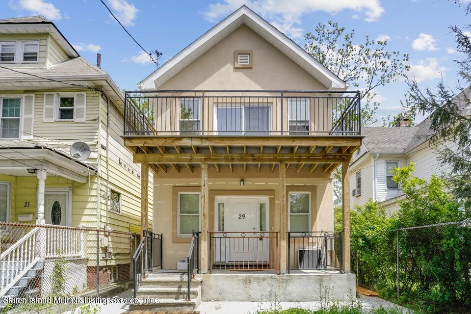 a front view of a house with a porch