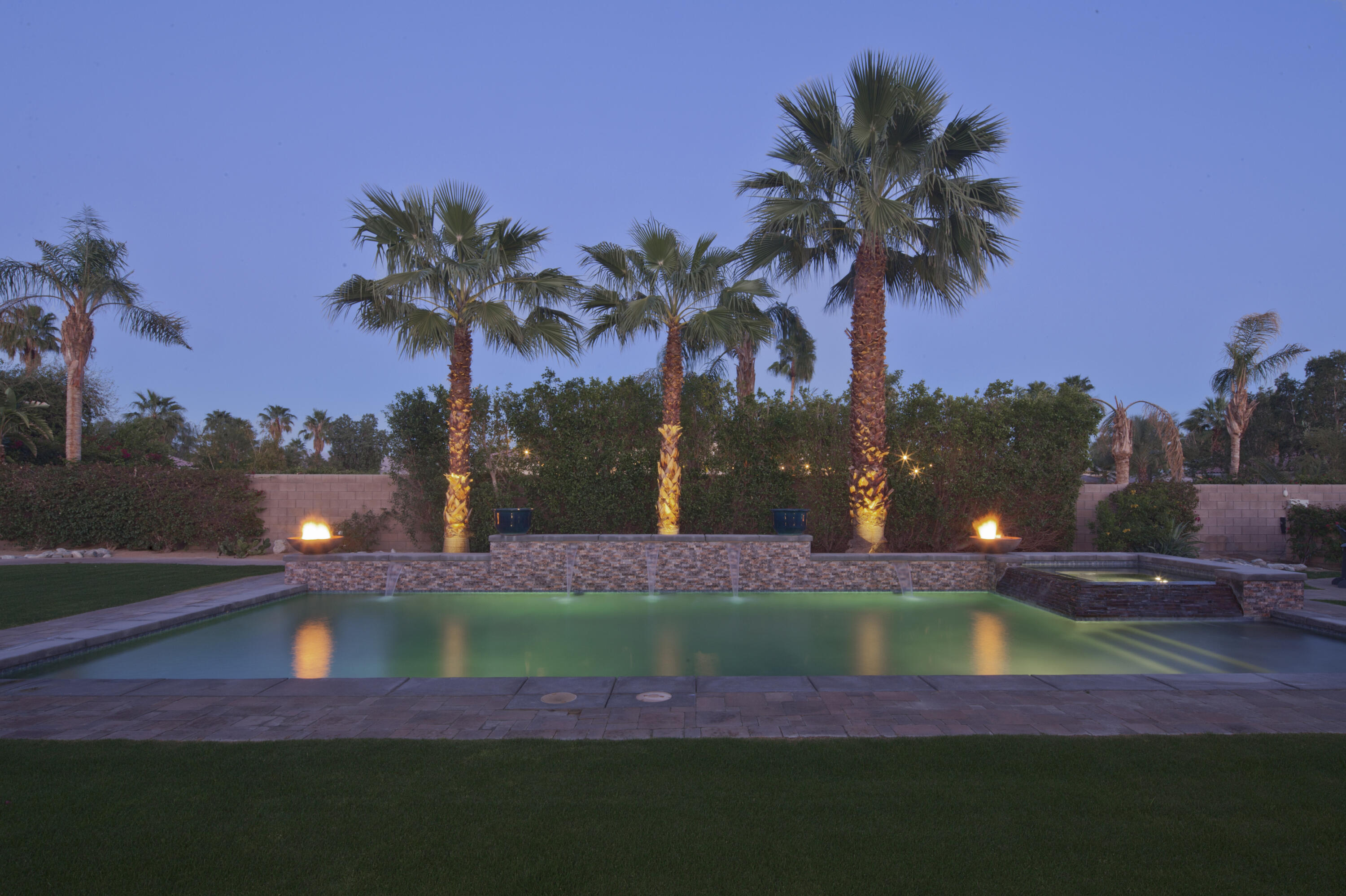 a view of a yard with a swimming pool