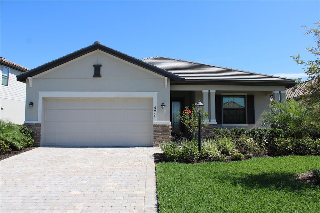 a front view of house with a yard