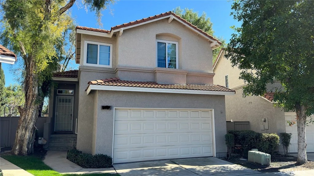 a front view of a house with a garage